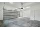 Spacious two car garage featuring an automatic overhead door and white painted walls at 2208 Baker Nw Rd, Atlanta, GA 30318