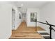 Bright hallway featuring modern flooring and glass railing at 2208 Baker Nw Rd, Atlanta, GA 30318