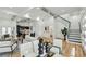 Bright, open-concept living room with modern furnishings and staircase at 2208 Baker Nw Rd, Atlanta, GA 30318