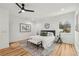 Bedroom suite with modern ceiling fan, ensuite, and large window at 2208 Baker Nw Rd, Atlanta, GA 30318