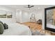 Bright and stylish main bedroom featuring a private balcony and modern furnishings at 2208 Baker Nw Rd, Atlanta, GA 30318