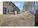 Sloped backyard with wooden fence and patio at 1901 Creel Ln, Atlanta, GA 30349