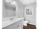 Clean bathroom with modern fixtures, a well-lit mirror, and a stylish vanity with ample counter space at 3599 Dial Dr, Stone Mountain, GA 30083