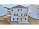 Backyard of a new construction home with a wood deck and walk out patio at 688 Calvet Way, Cumming, GA 30041