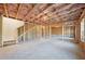 Unfinished basement with wood framing and concrete flooring at 688 Calvet Way, Cumming, GA 30041