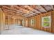 Unfinished basement with exposed beams and visible insulation at 688 Calvet Way, Cumming, GA 30041