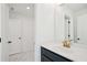 Modern bathroom featuring a white vanity with gold faucet and tiled floor at 688 Calvet Way, Cumming, GA 30041