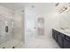 Luxury bathroom with a glass shower, bathtub, double vanity and marble floor at 688 Calvet Way, Cumming, GA 30041