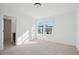 Bright bedroom with large window and neutral carpet at 688 Calvet Way, Cumming, GA 30041