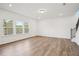 Bright living room featuring hardwood floors, recessed lighting, and staircase at 688 Calvet Way, Cumming, GA 30041