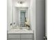 Clean and modern half bathroom with white vanity and quartz countertop at 617 Harrington Hls, Decatur, GA 30032