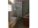 This bathroom features a soaking tub and glass enclosed shower for a spa-like experience at 138 Le Brun Ne Rd, Atlanta, GA 30342