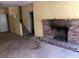 Living room featuring brick fireplace and stairs at 138 Le Brun Ne Rd, Atlanta, GA 30342