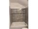 Bathroom with shower/tub combo and grey tile at 2254 Wellington Cir, Lithonia, GA 30058