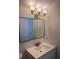 Clean bathroom, featuring a vanity with a rectangular mirror at 2254 Wellington Cir, Lithonia, GA 30058