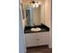 Bathroom with vanity, updated sink, and modern mirror at 2254 Wellington Cir, Lithonia, GA 30058