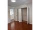 Spacious bedroom with hardwood floors and double door closet at 2254 Wellington Cir, Lithonia, GA 30058