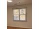 Bedroom with new blinds, hardwood floors, and a window at 2254 Wellington Cir, Lithonia, GA 30058