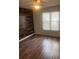 Bedroom with wood-look floors and window coverings at 2254 Wellington Cir, Lithonia, GA 30058