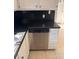 Stainless steel dishwasher installed in corner of kitchen with black countertop at 2254 Wellington Cir, Lithonia, GA 30058