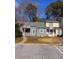 Two-story townhome with gray siding and small front yard at 2254 Wellington Cir, Lithonia, GA 30058