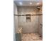 Large tiled shower with built-in seat at 2254 Wellington Cir, Lithonia, GA 30058