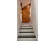 Modern staircase with wood accent wall at 2254 Wellington Cir, Lithonia, GA 30058