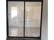 Glass sliding doors leading to a bright sunroom with tiled flooring at 2254 Wellington Cir, Lithonia, GA 30058