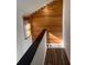 Light-filled upper hallway with wood wall accents and modern flooring at 2254 Wellington Cir, Lithonia, GA 30058