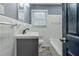 Classic bathroom with white tile and tub at 4598 Flint Hill Rd, Austell, GA 30106