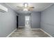 Cozy bedroom with ceiling fan and gray walls at 4598 Flint Hill Rd, Austell, GA 30106