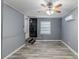 Spacious bedroom with gray walls and ceiling fan at 4598 Flint Hill Rd, Austell, GA 30106