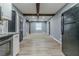 Open concept kitchen with exposed beams and modern flooring at 4598 Flint Hill Rd, Austell, GA 30106