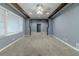 Bright living room with neutral carpeting and window blinds at 4598 Flint Hill Rd, Austell, GA 30106
