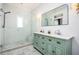 Spa-like bathroom with a walk-in shower, double vanity, and marble flooring at 796 Palatine Se Ave, Atlanta, GA 30316