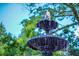 A close up view of a tiered water fountain with water spraying and a tree in the background at 100 Marietta Walk Trce, Marietta, GA 30064