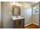 Simple bathroom with single vanity and mirror at 516 Richards Rd, White, GA 30184