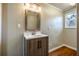Bathroom with modern vanity, sink, and lighting fixtures at 516 Richards Rd, White, GA 30184