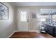 Inviting entryway with decorative glass door, hardwood floors, and warm, neutral paint colors at 516 Richards Rd, White, GA 30184