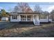 Charming single-story home with a welcoming front porch and well-manicured lawn at 516 Richards Rd, White, GA 30184