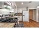 Bright kitchen with modern appliances, ample counter space, and stylish tile backsplash at 516 Richards Rd, White, GA 30184