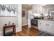 Kitchen featuring white cabinets and stainless-steel appliances at 516 Richards Rd, White, GA 30184