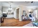 Kitchen that flows into the living room, featuring white cabinets and stainless-steel appliances at 516 Richards Rd, White, GA 30184