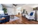 Spacious living room featuring hardwood floors, a ceiling fan, and ample seating at 516 Richards Rd, White, GA 30184