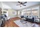 Bright living room with large windows, hardwood floors, and modern furnishings at 516 Richards Rd, White, GA 30184