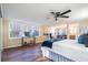 Bright main bedroom with ensuite bathroom, ceiling fan and hardwood floors at 516 Richards Rd, White, GA 30184