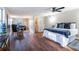 Large main bedroom with ceiling fan, view into the seating area and ensuite bath at 516 Richards Rd, White, GA 30184