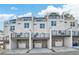 Three-story townhome building with attached garages at 1923 Rogers Ct, Atlanta, GA 30318