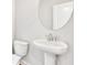 Small powder room with pedestal sink and toilet at 1923 Rogers Ct, Atlanta, GA 30318