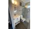 Bathroom with walk-in shower, white vanity, and gray tile at 534 Hamilton E Holmes Dr, Atlanta, GA 30318